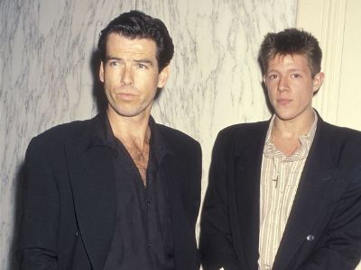 Both Pierce Brosnan and Christopher Brosnan is wearing a black suit.